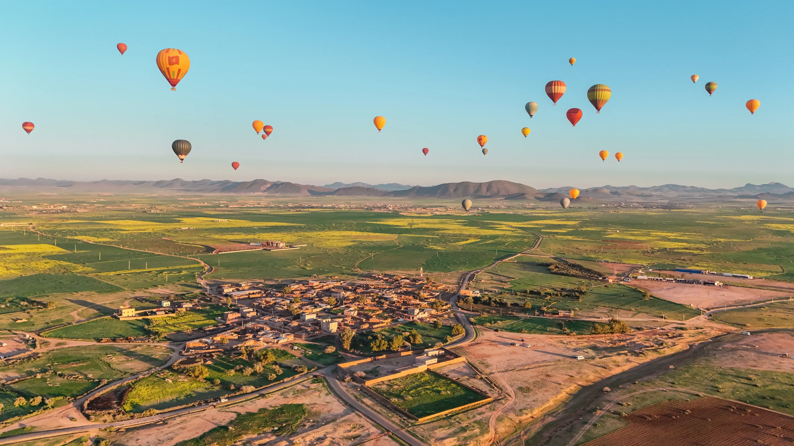 Panoramic view of Atlas Mountains and desert from hot air balloon Marrakech
